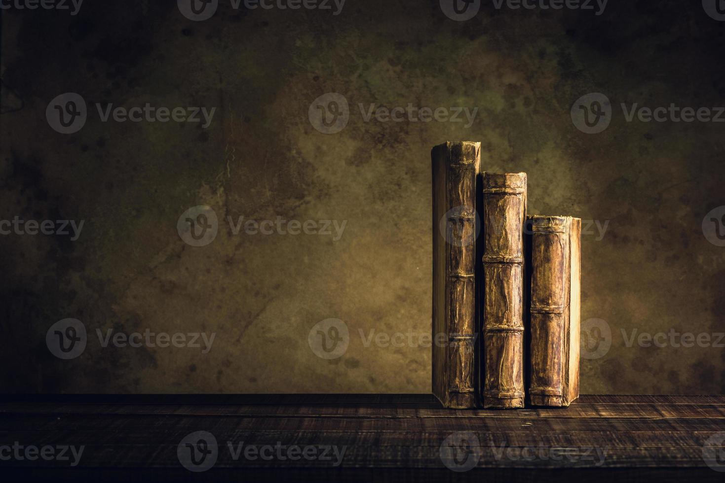 old books vintage on wood floor and paper aged background or texture photo
