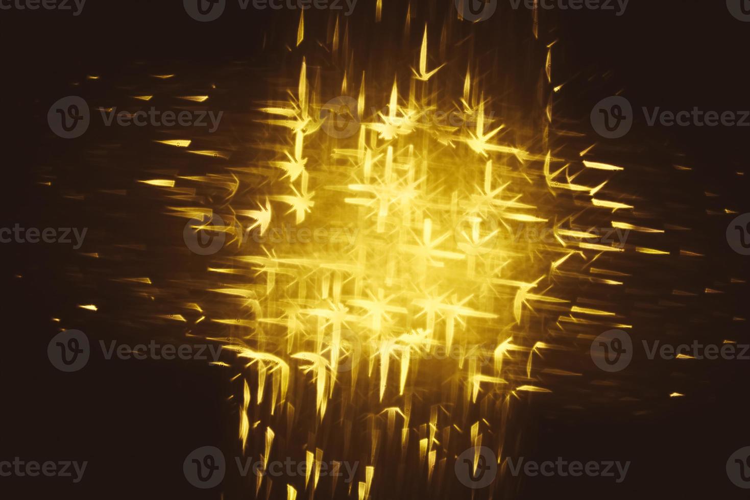Golden glitter bokeh lighting texture Blurred abstract background for birthday, anniversary, wedding, new year eve or Christmas photo