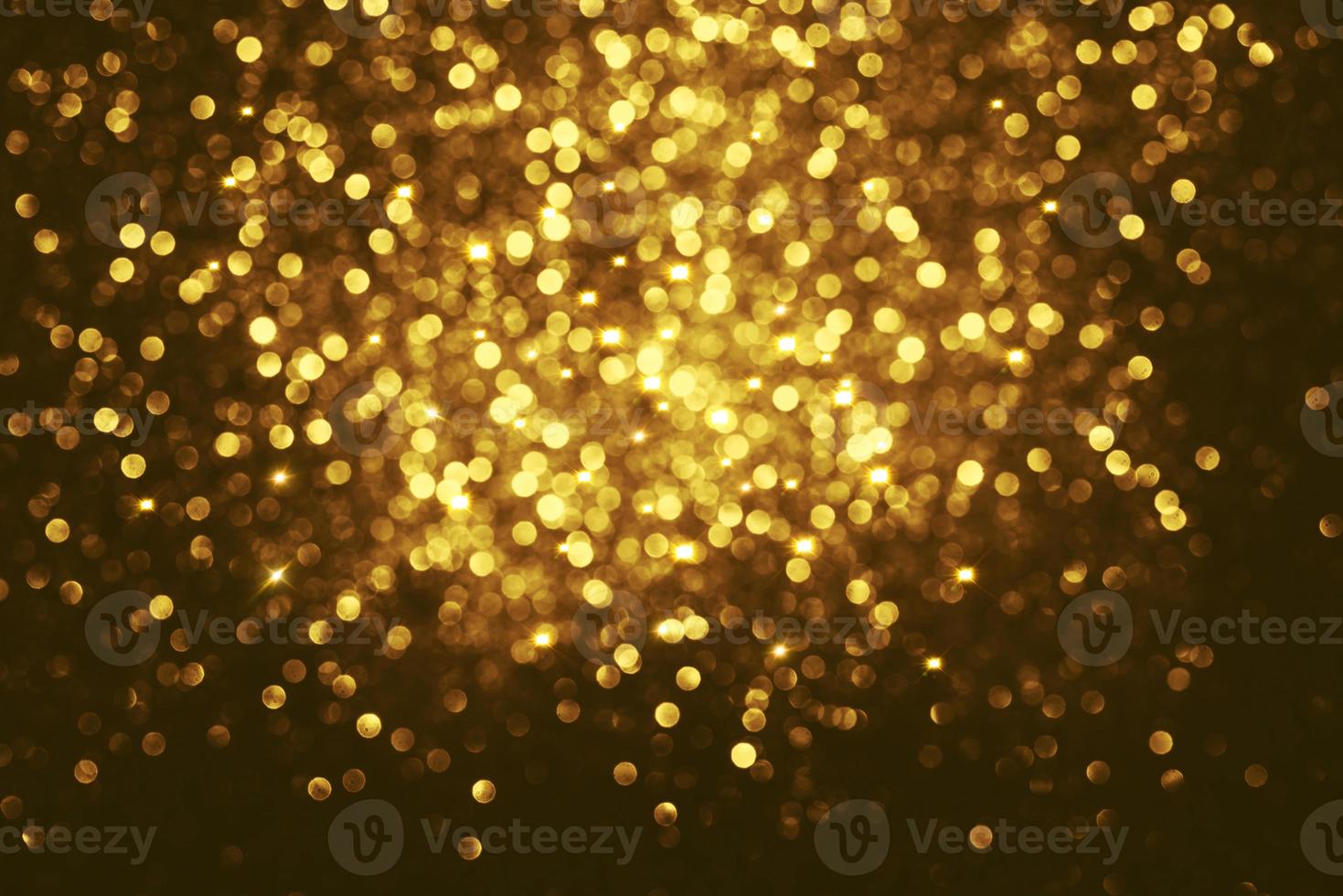 Golden glitter bokeh lighting texture Blurred abstract background for birthday, anniversary, wedding, new year eve or Christmas photo