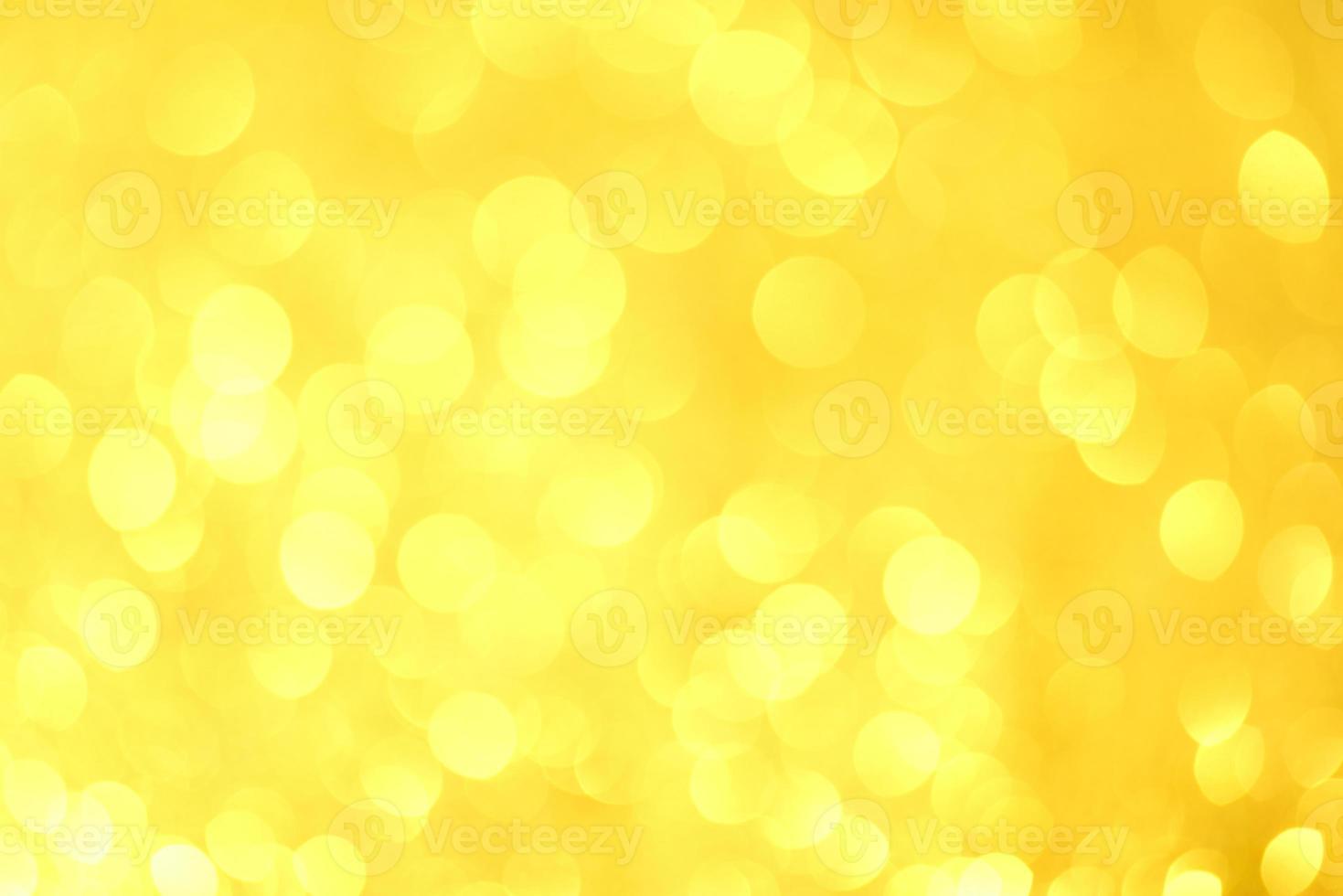 Golden glitter bokeh lighting texture Blurred abstract background for birthday, anniversary, wedding, new year eve or Christmas photo