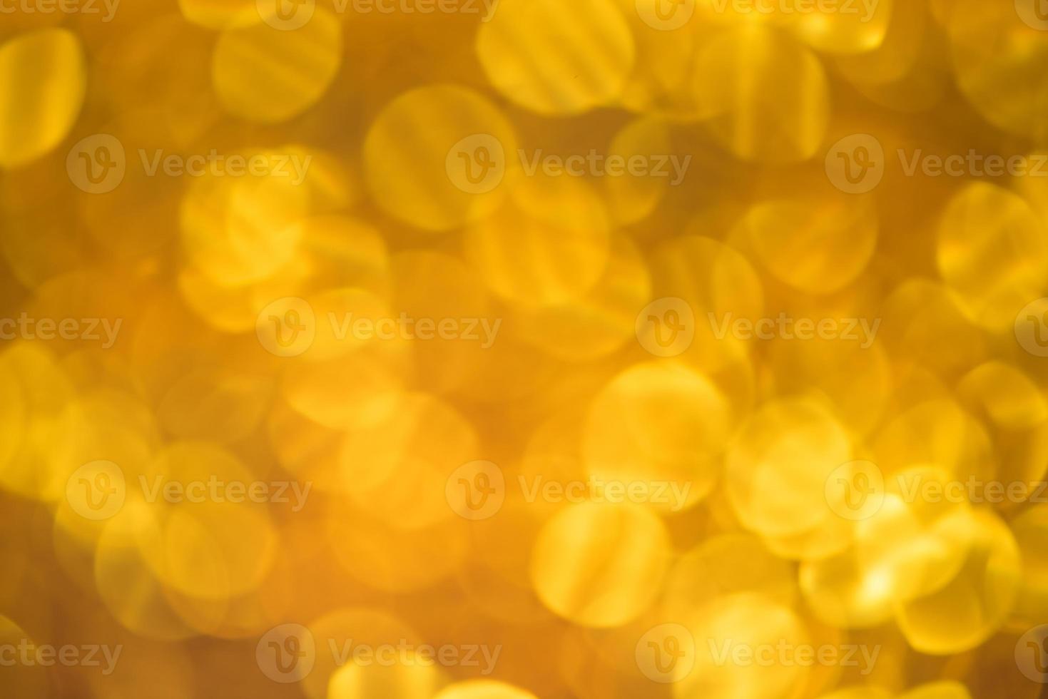 Golden glitter bokeh lighting texture Blurred abstract background for birthday, anniversary, wedding, new year eve or Christmas photo
