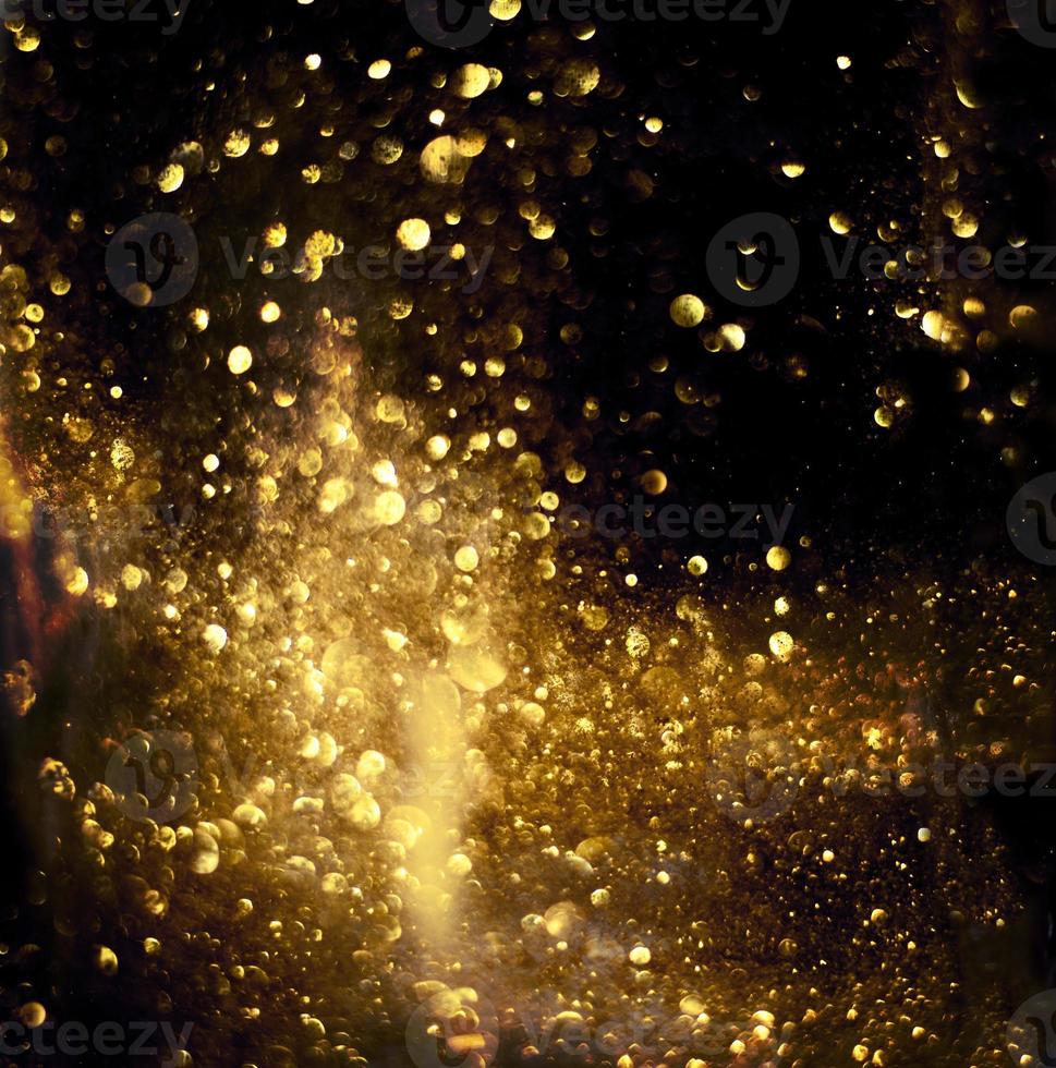 Golden glitter bokeh lighting texture Blurred abstract background for birthday, anniversary, wedding, new year eve or Christmas photo