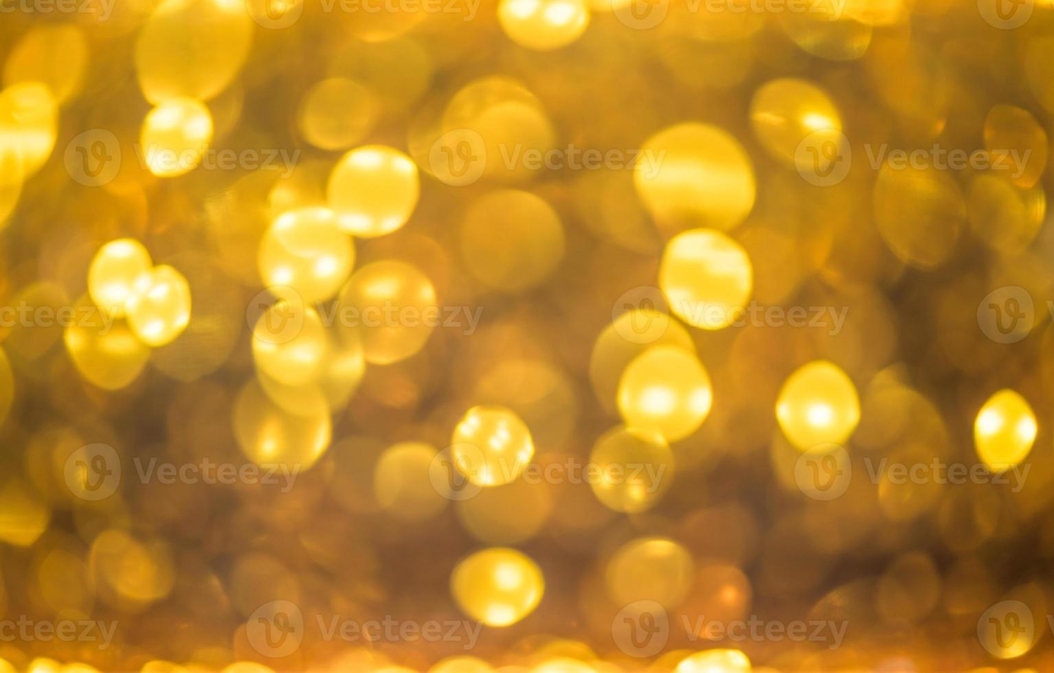 Golden glitter bokeh lighting texture Blurred abstract background for birthday, anniversary, wedding, new year eve or Christmas photo