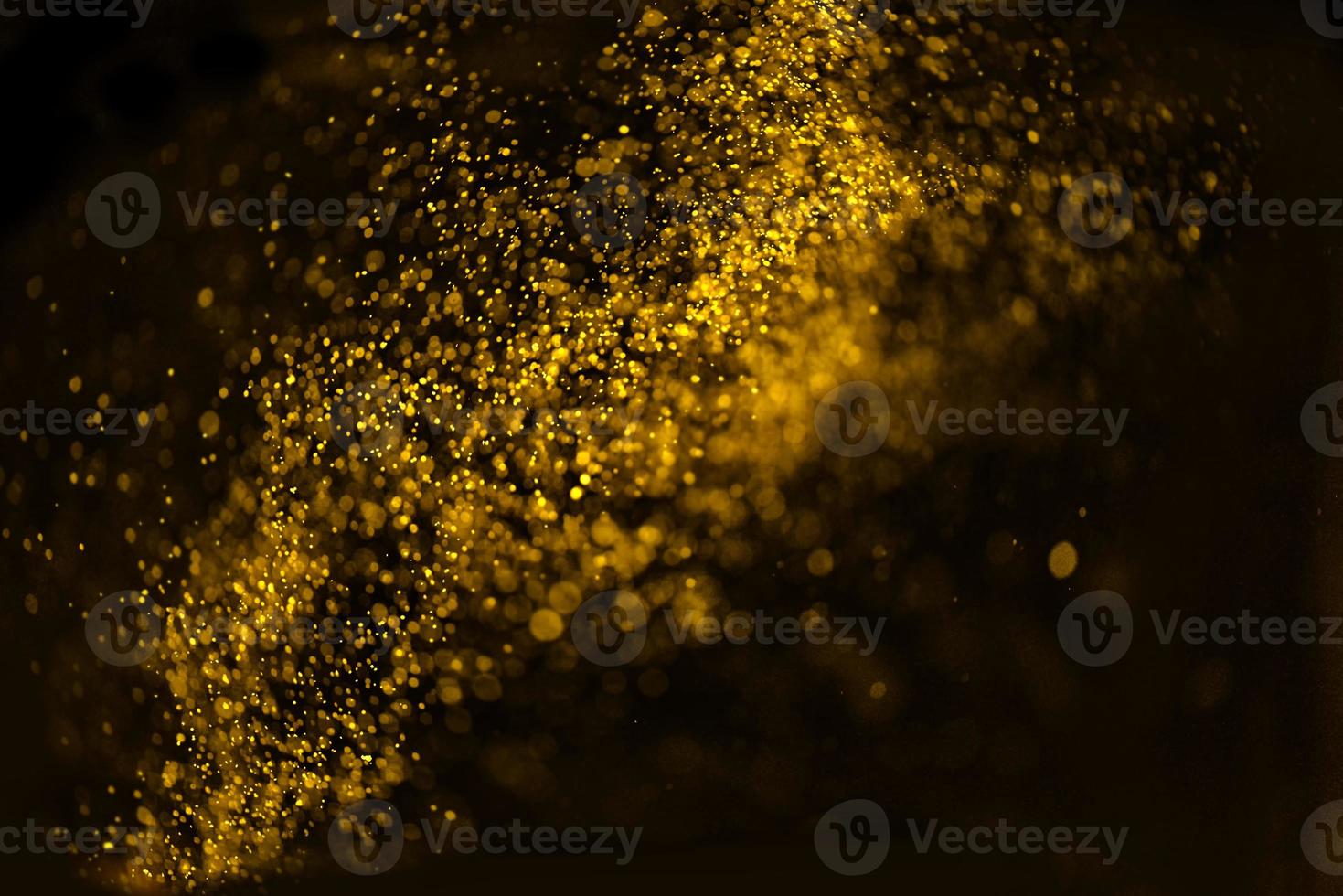 Golden glitter bokeh lighting texture Blurred abstract background for birthday, anniversary, wedding, new year eve or Christmas photo