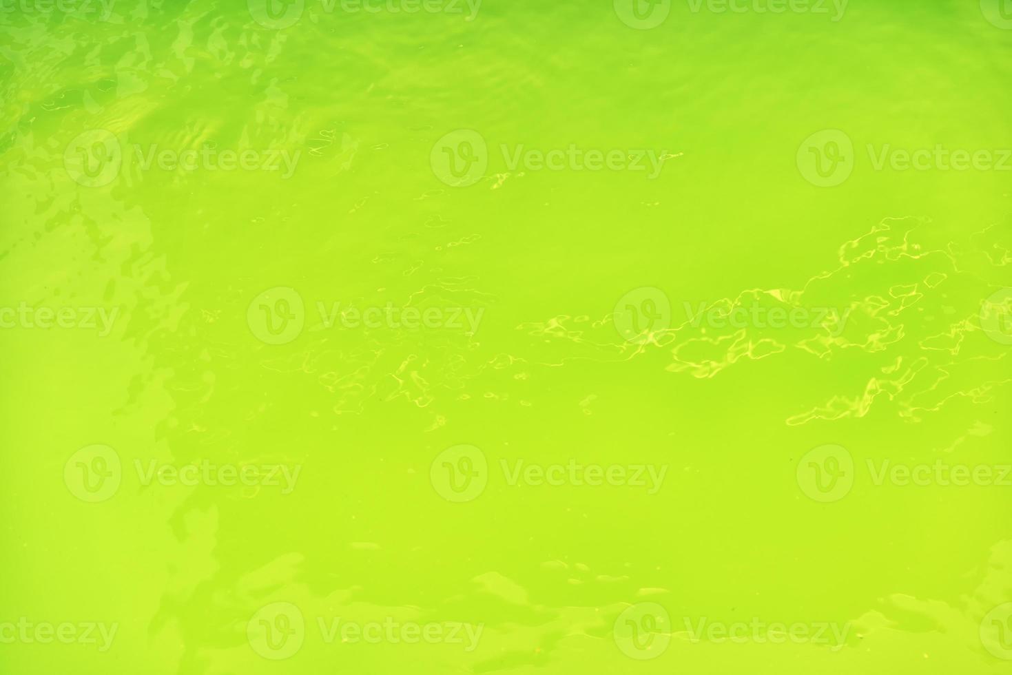 Waving water surface background in the pool. photo