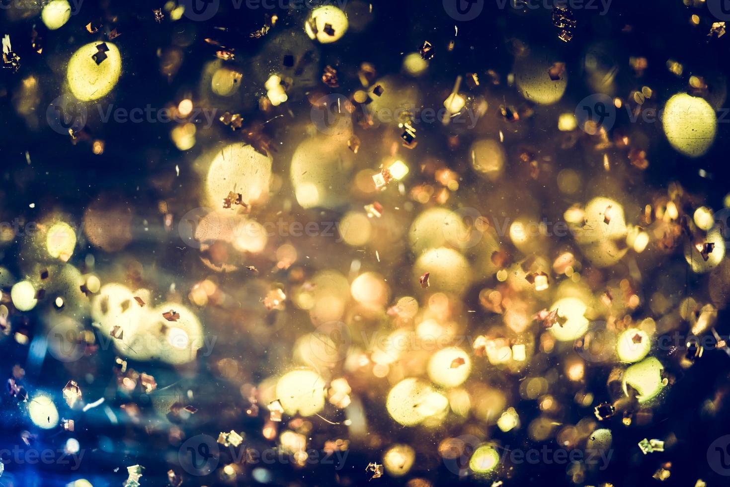 Golden glitter bokeh lighting texture Blurred abstract background for birthday, anniversary, wedding, new year eve or Christmas photo