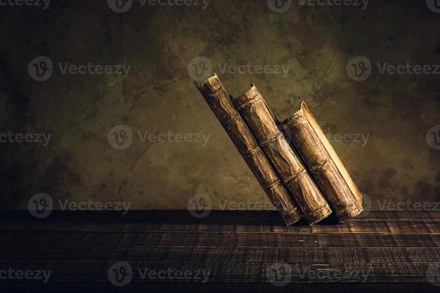 old books vintage on wood floor and paper aged background or texture photo