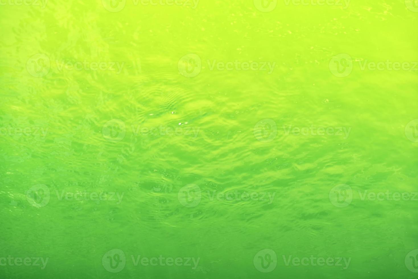 Waving water surface background in the pool. photo
