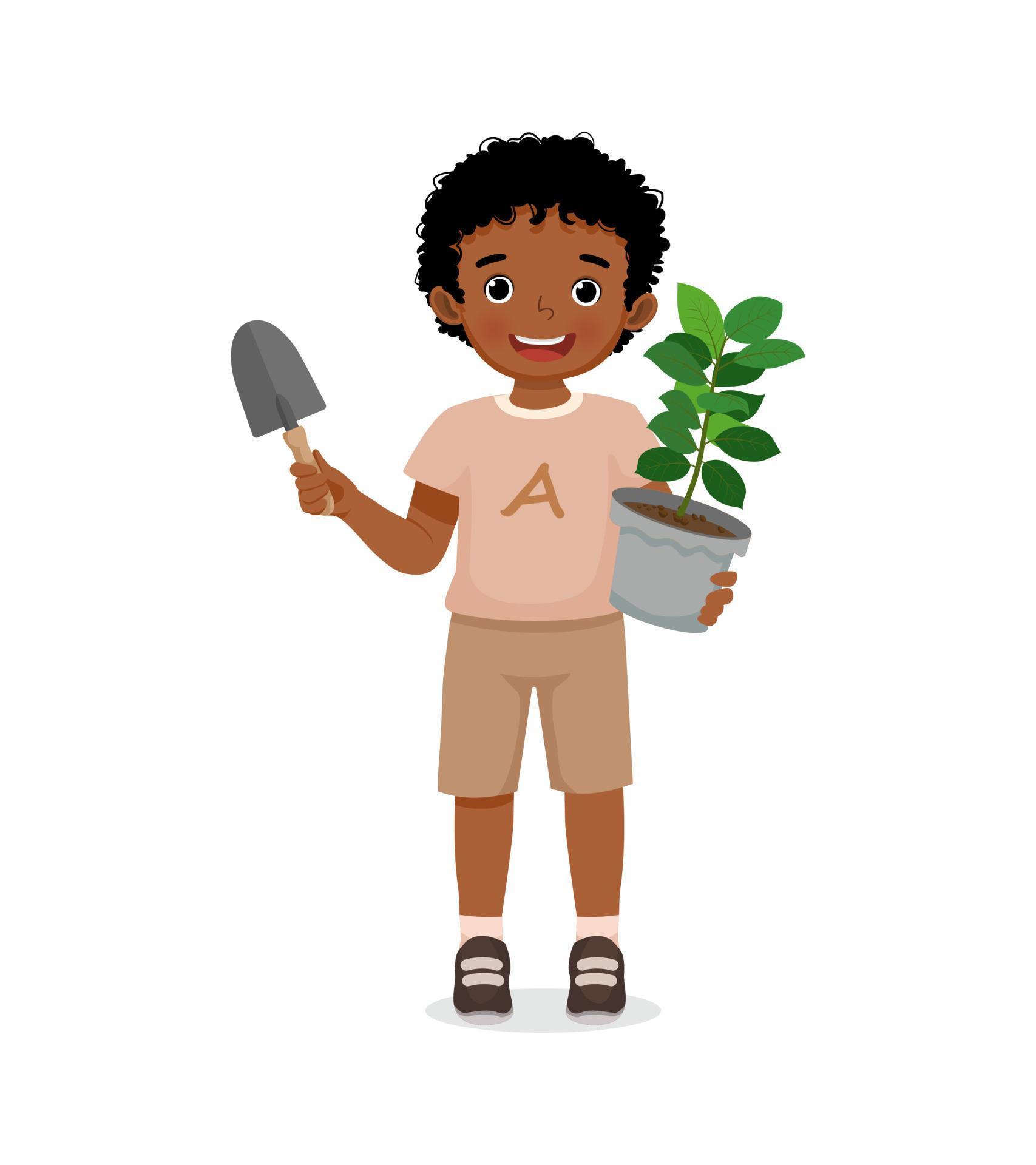 happy little African boy holding potted plant and shovel in the garden