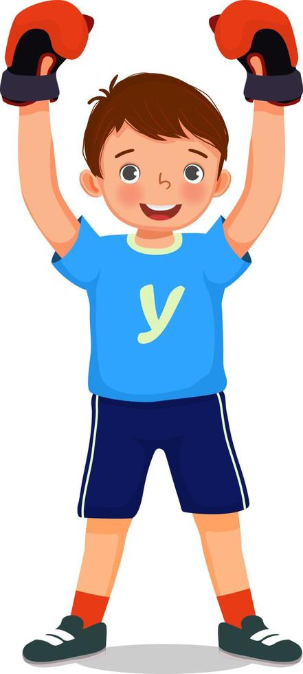 Cute little boy boxer wearing boxing glove rejoices in a victory raising hands in winner position vector