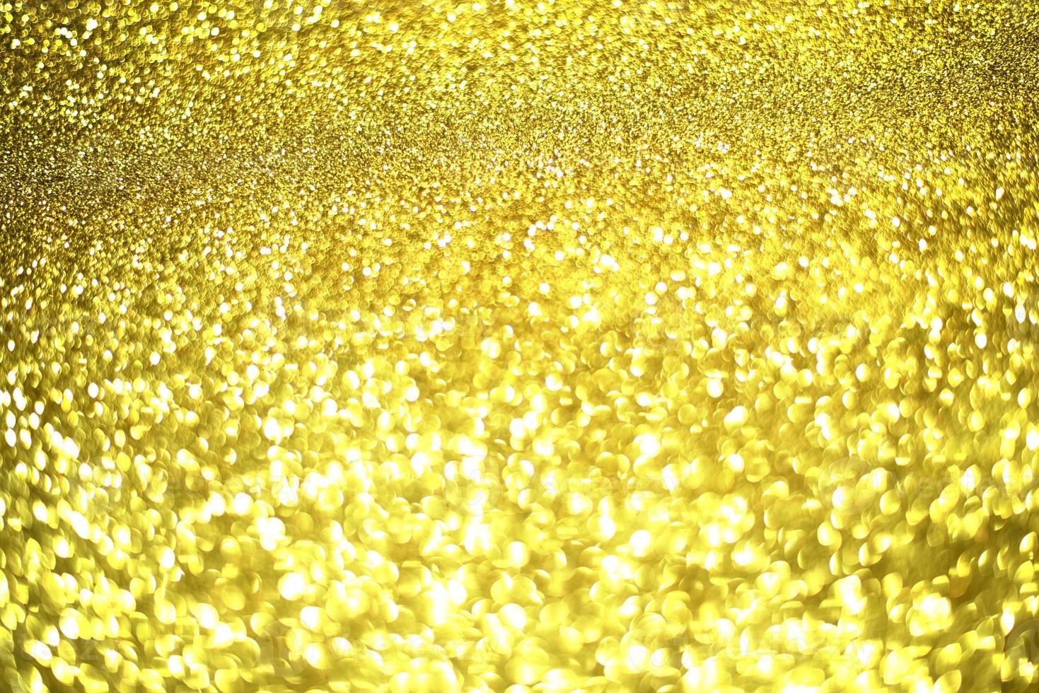 Golden glitter bokeh lighting texture Blurred abstract background for birthday, anniversary, wedding, new year eve or Christmas photo