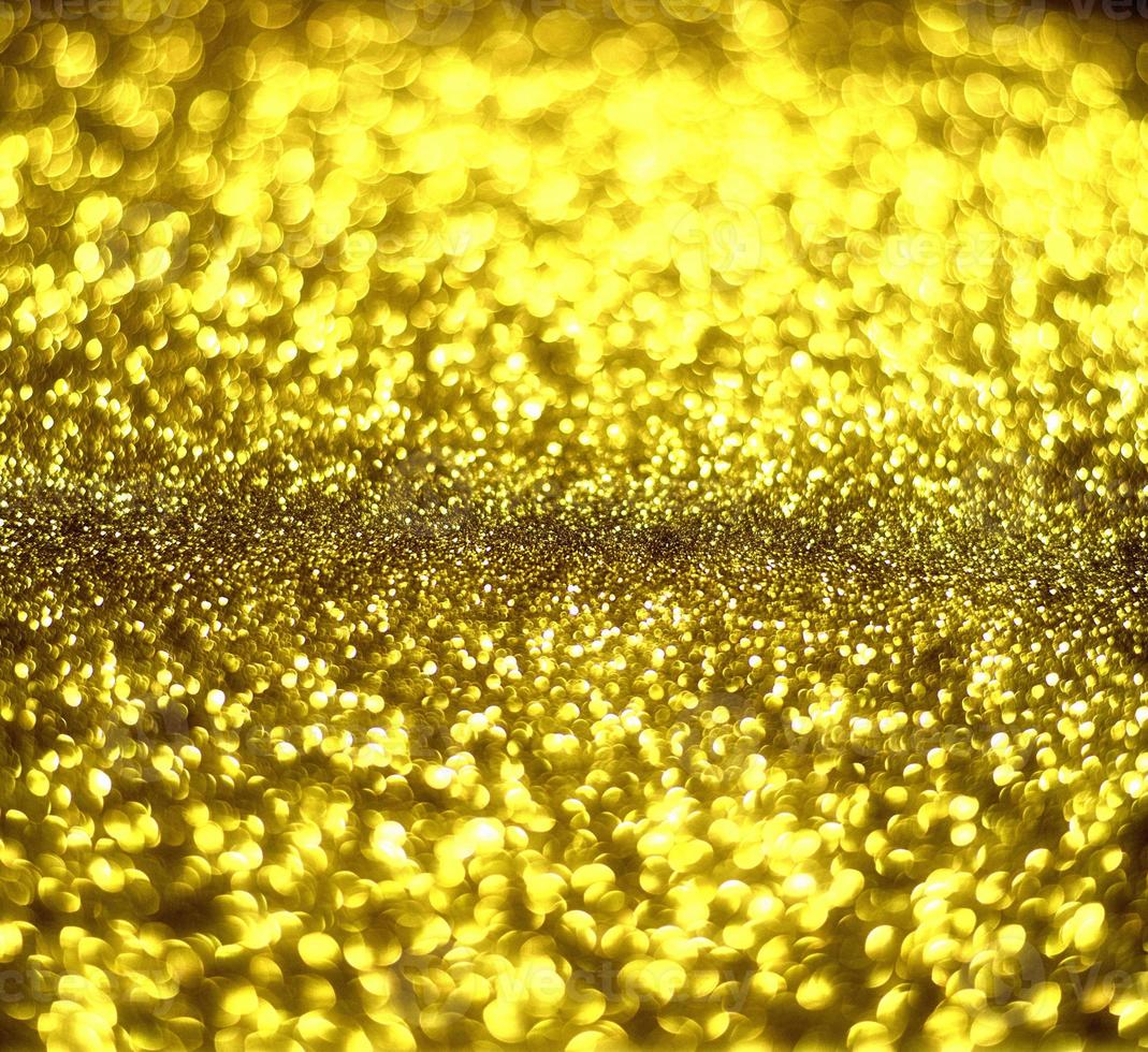 Golden glitter bokeh lighting texture Blurred abstract background for birthday, anniversary, wedding, new year eve or Christmas photo