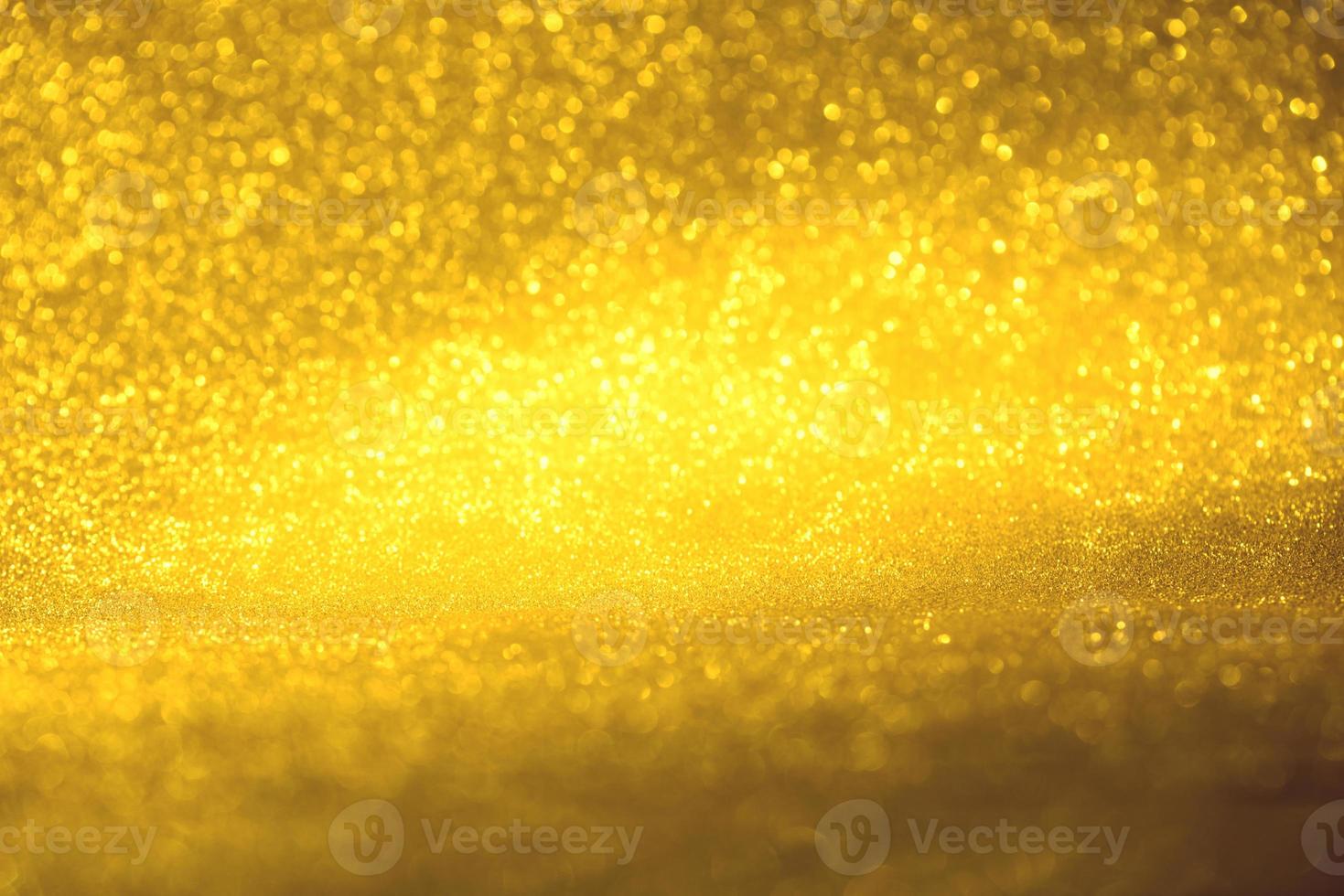 Golden glitter bokeh lighting texture Blurred abstract background for birthday, anniversary, wedding, new year eve or Christmas photo