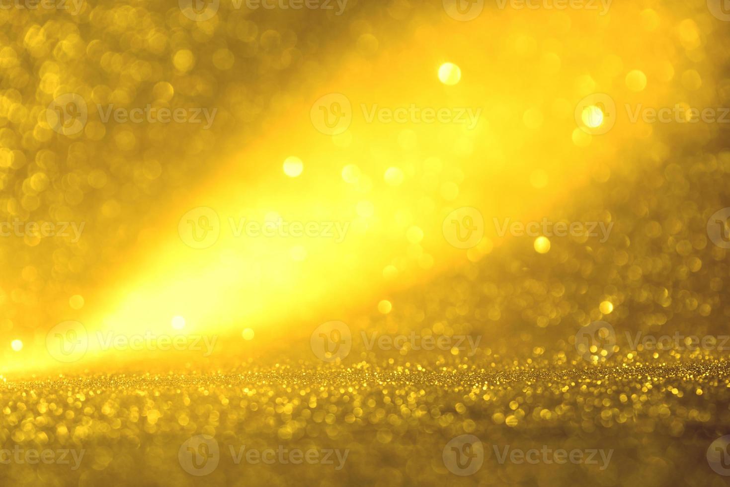 Golden glitter bokeh lighting texture Blurred abstract background for birthday, anniversary, wedding, new year eve or Christmas photo