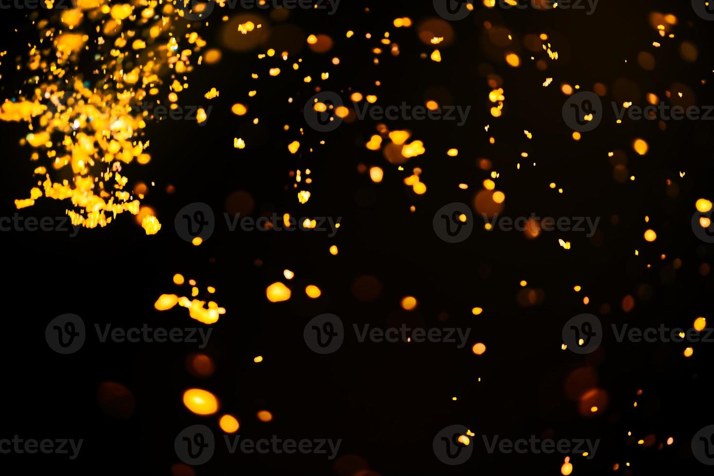 Golden glitter bokeh lighting texture Blurred abstract background for birthday, anniversary, wedding, new year eve or Christmas photo