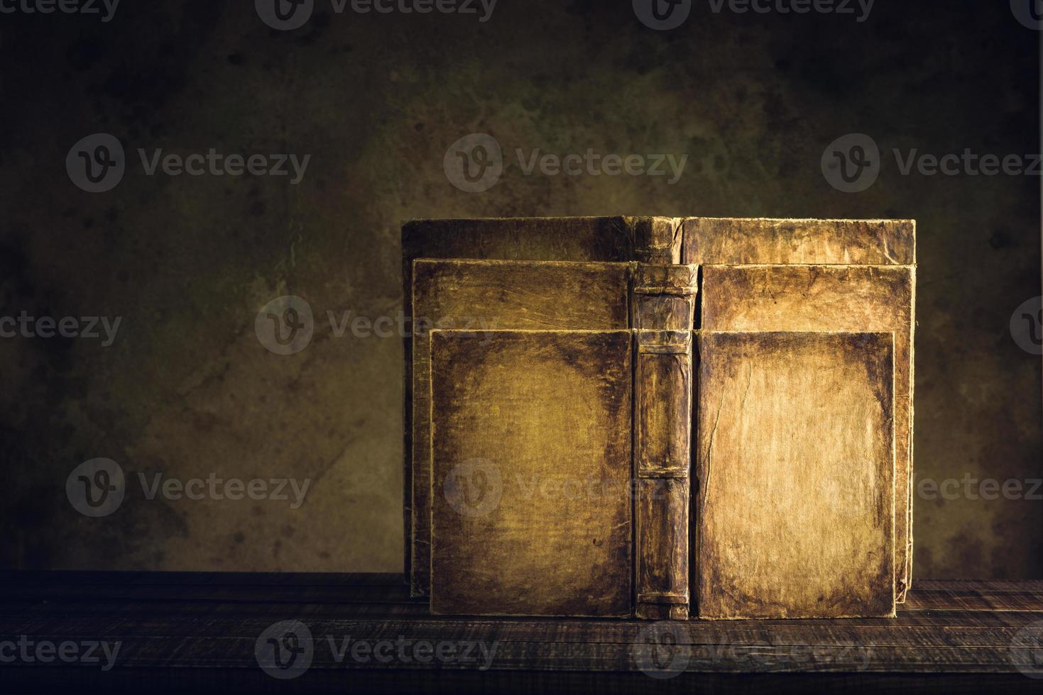 old books vintage on wood floor and paper aged background or texture photo