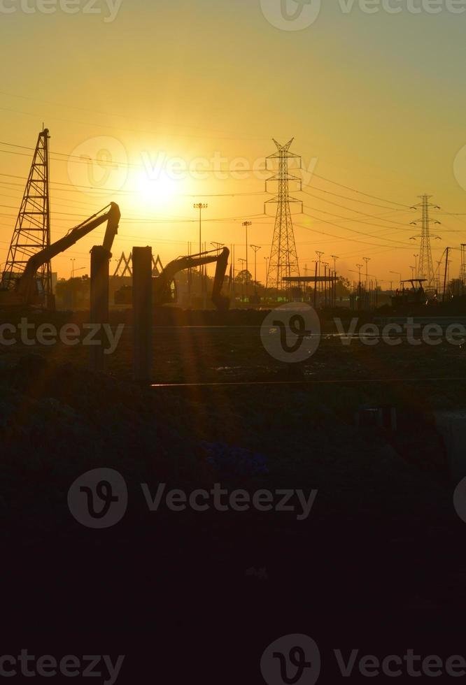 construction site and electrical Pole with Sunrise sky photo