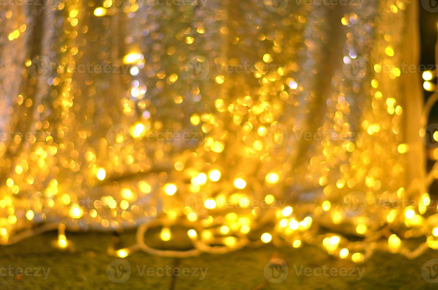 Golden glitter bokeh lighting texture Blurred abstract background for birthday, anniversary, wedding, new year eve or Christmas photo