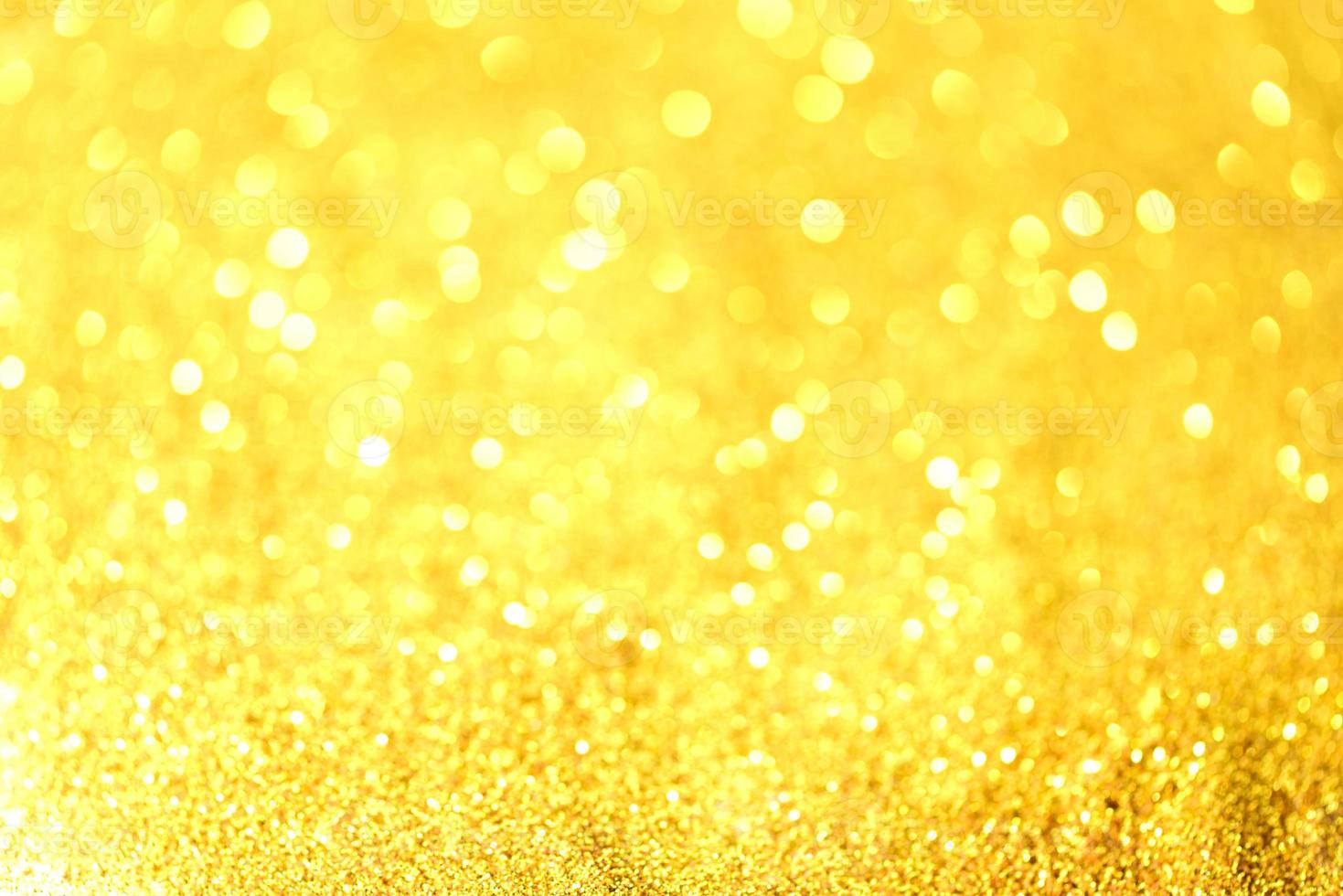 Golden glitter bokeh lighting texture Blurred abstract background for birthday, anniversary, wedding, new year eve or Christmas photo