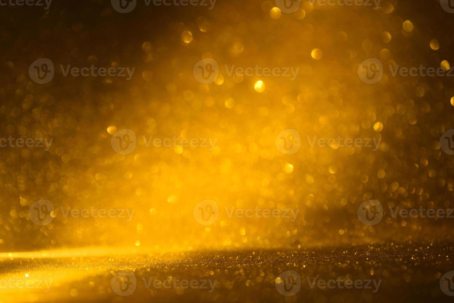 Golden glitter bokeh lighting texture Blurred abstract background for birthday, anniversary, wedding, new year eve or Christmas photo