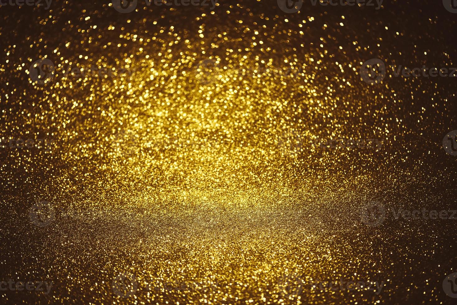Golden glitter bokeh lighting texture Blurred abstract background for birthday, anniversary, wedding, new year eve or Christmas photo