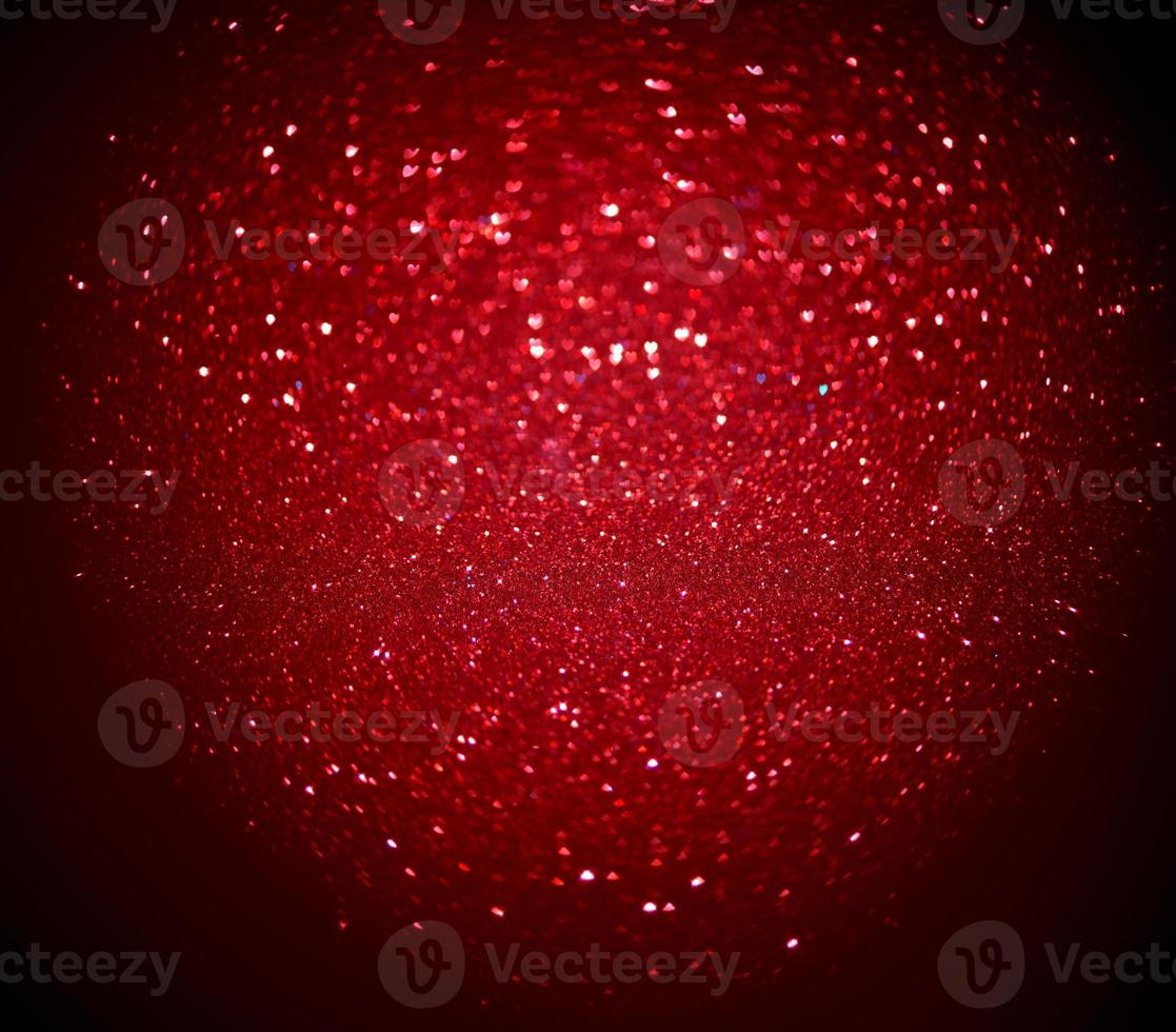 Red Blur heart shape of ligth bokeh on a black background photo