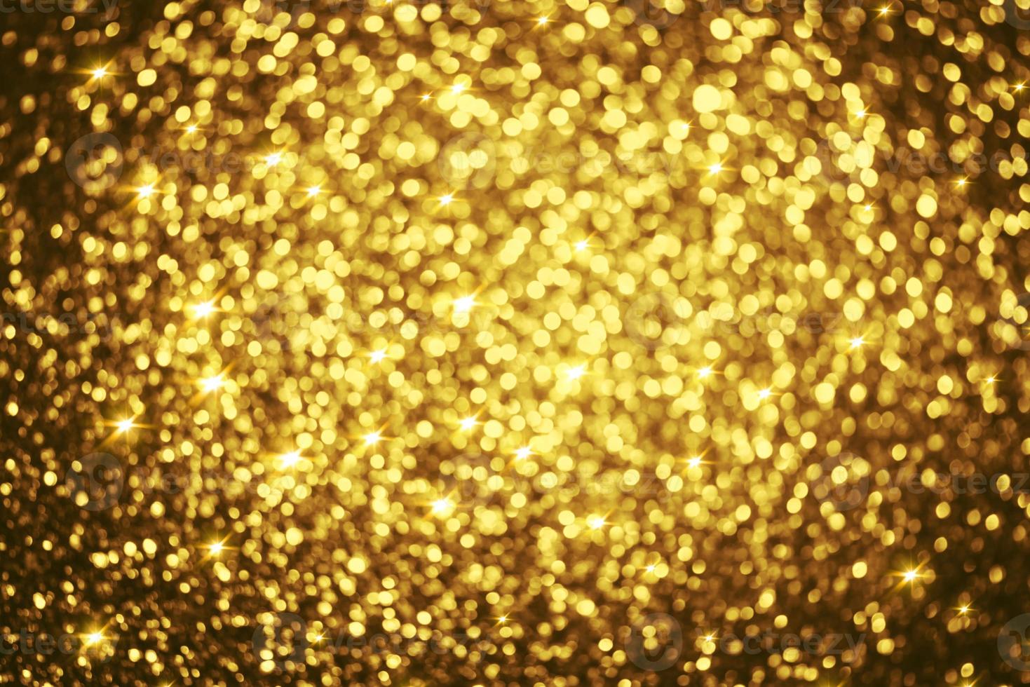 Golden glitter bokeh lighting texture Blurred abstract background for birthday, anniversary, wedding, new year eve or Christmas photo