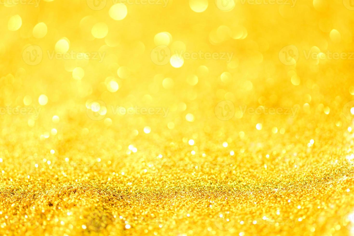 Golden glitter bokeh lighting texture Blurred abstract background for birthday, anniversary, wedding, new year eve or Christmas photo