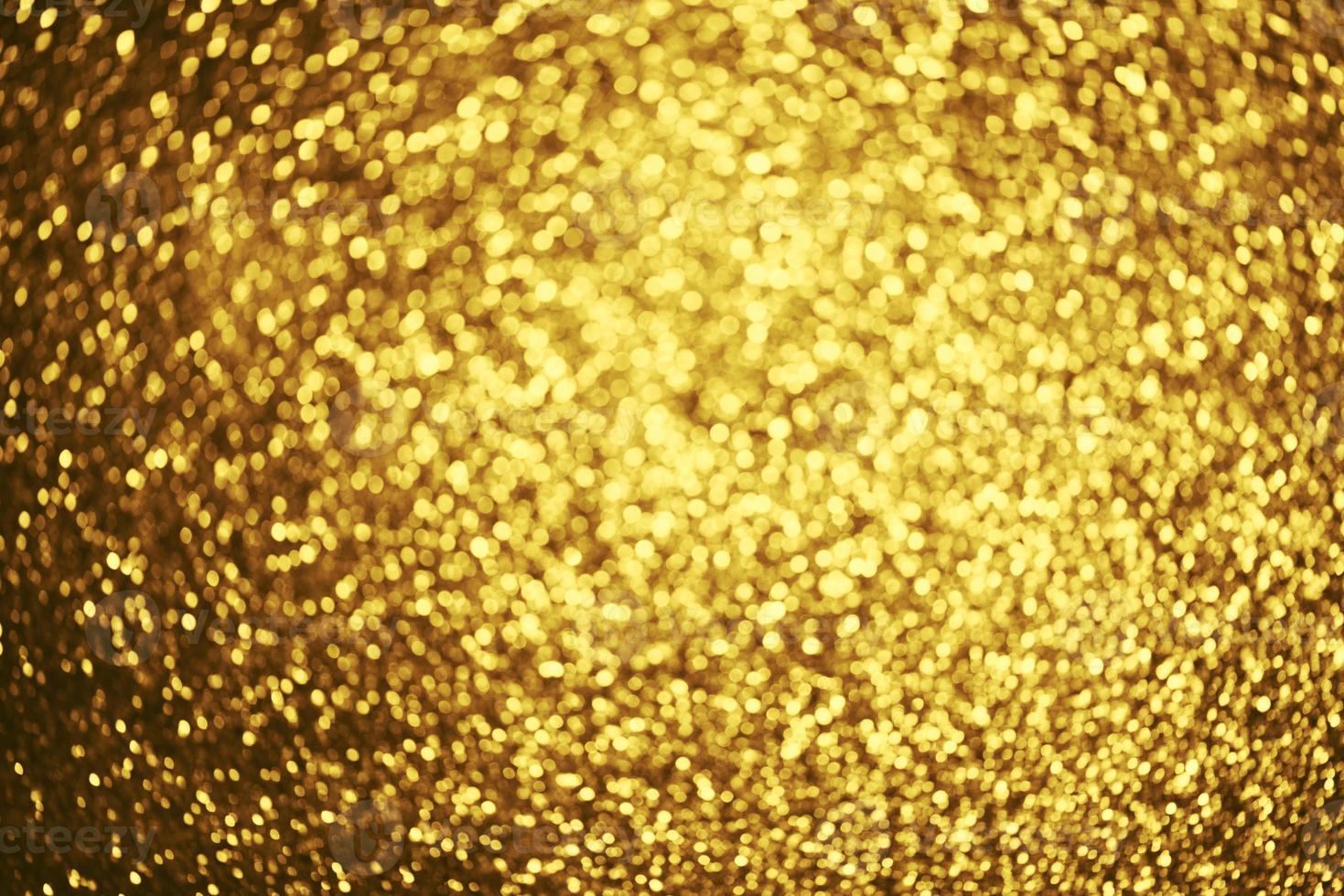 Golden glitter bokeh lighting texture Blurred abstract background for birthday, anniversary, wedding, new year eve or Christmas photo