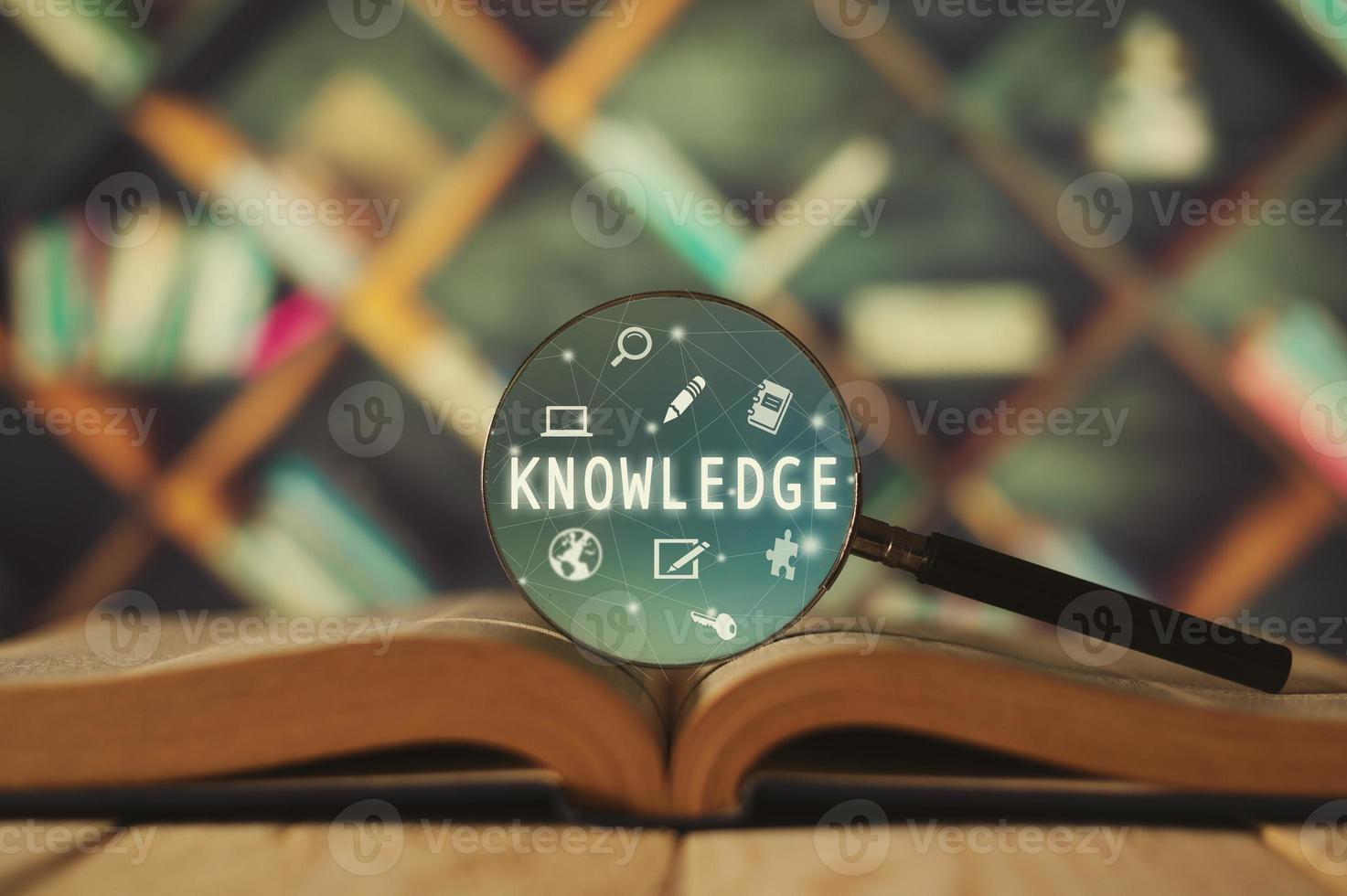 Open book on old wooden table.  Knowledge, education concept photo