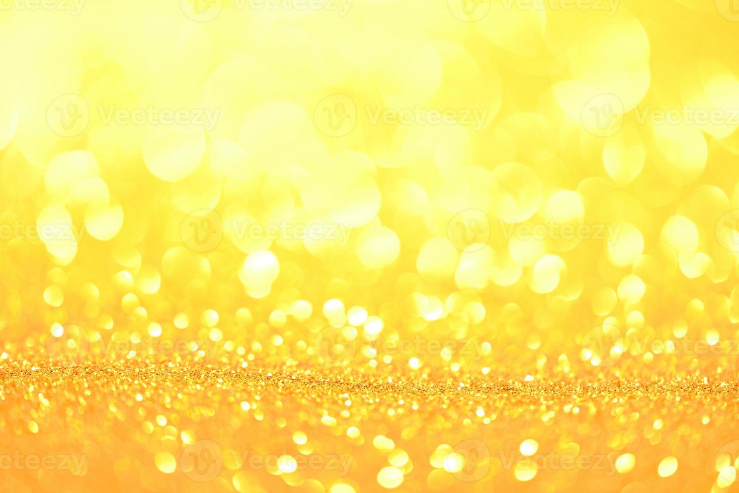 Golden glitter bokeh lighting texture Blurred abstract background for birthday, anniversary, wedding, new year eve or Christmas photo