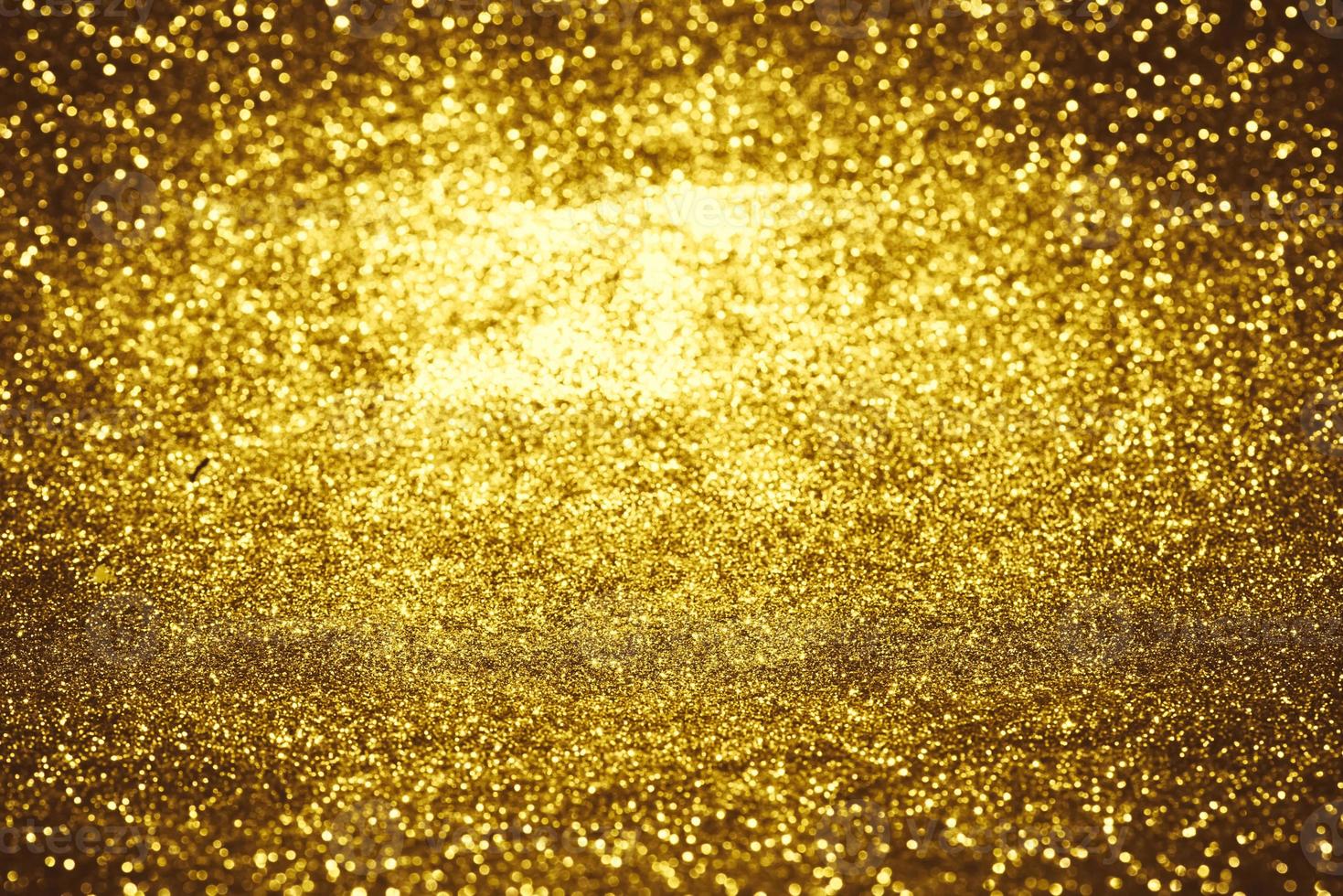 Golden glitter bokeh lighting texture Blurred abstract background for birthday, anniversary, wedding, new year eve or Christmas photo