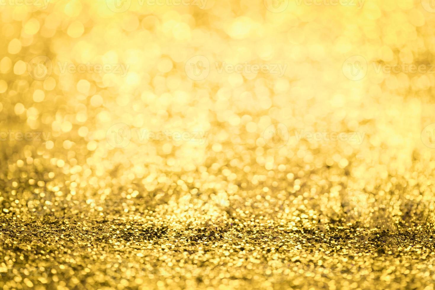 Golden glitter bokeh lighting texture Blurred abstract background for birthday, anniversary, wedding, new year eve or Christmas photo