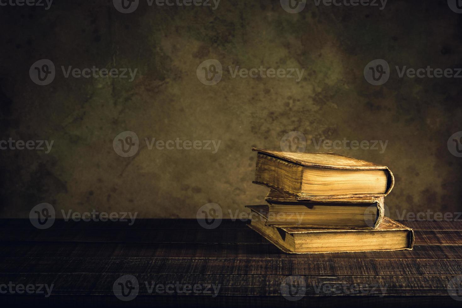 old books vintage on wood floor and paper aged background or texture photo