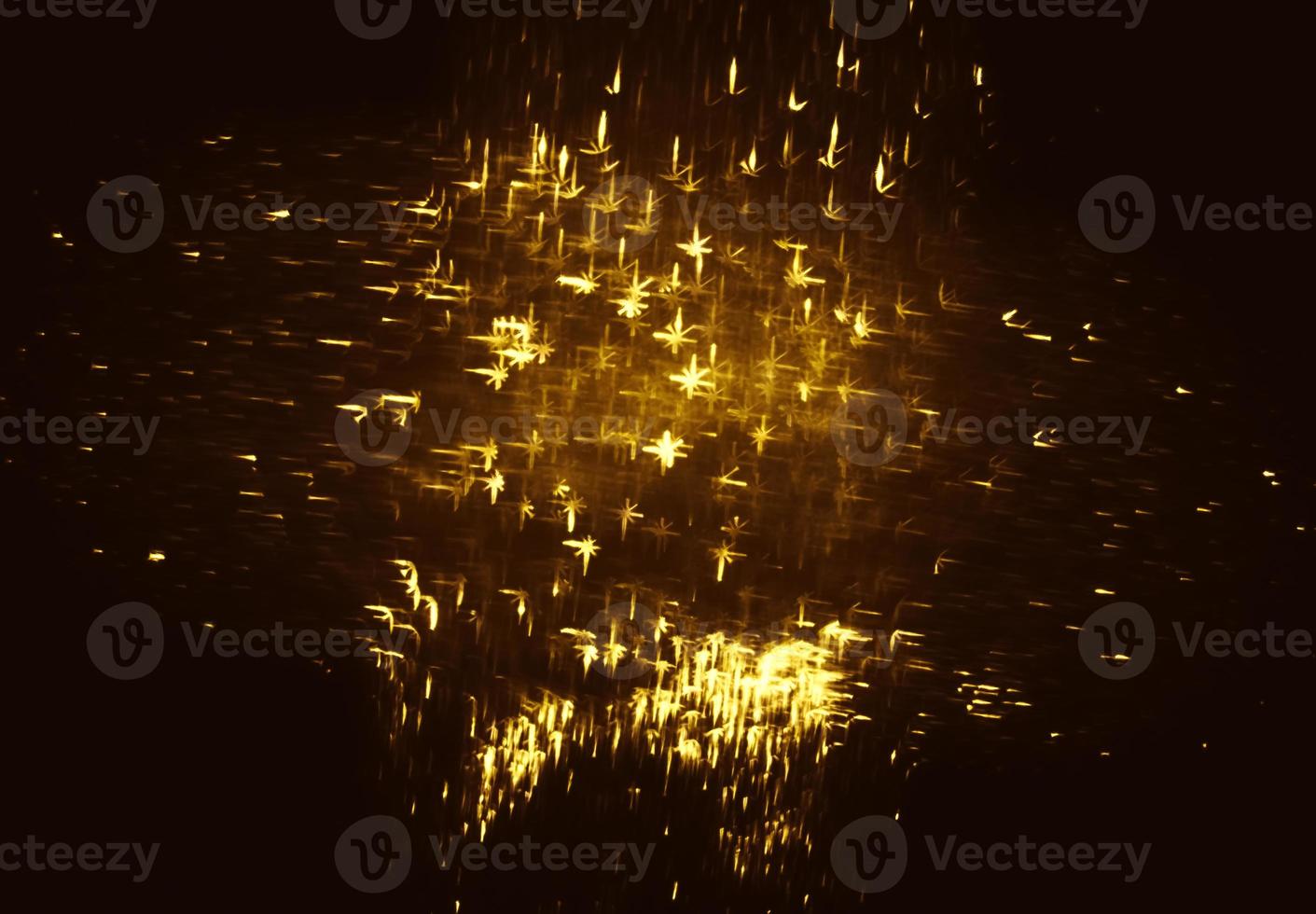 Golden glitter bokeh lighting texture Blurred abstract background for birthday, anniversary, wedding, new year eve or Christmas photo