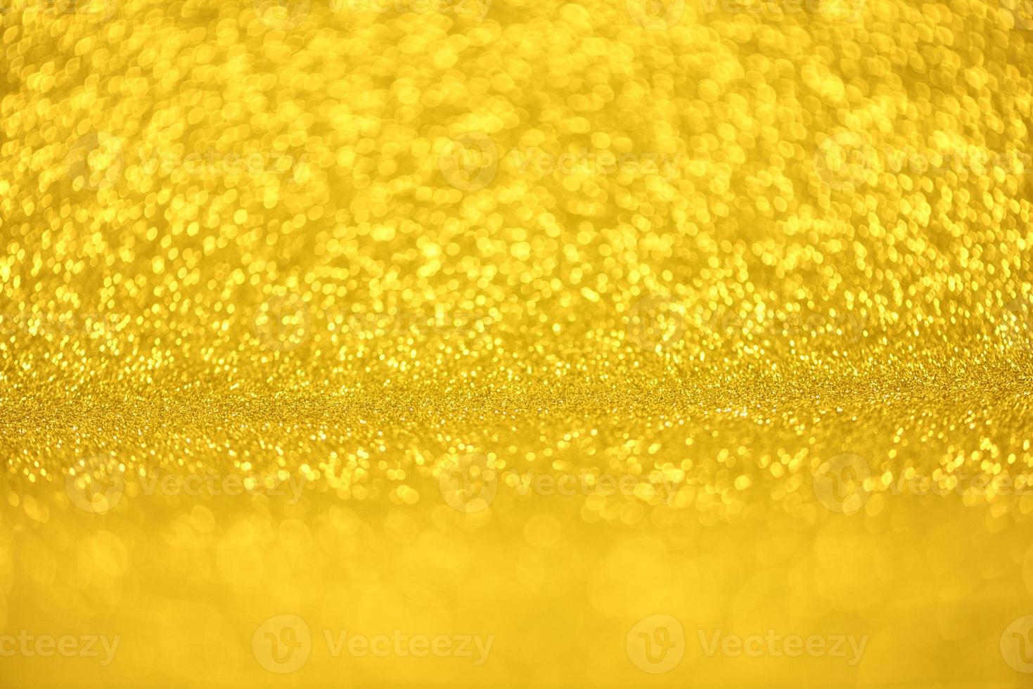 Golden glitter bokeh lighting texture Blurred abstract background for birthday, anniversary, wedding, new year eve or Christmas photo