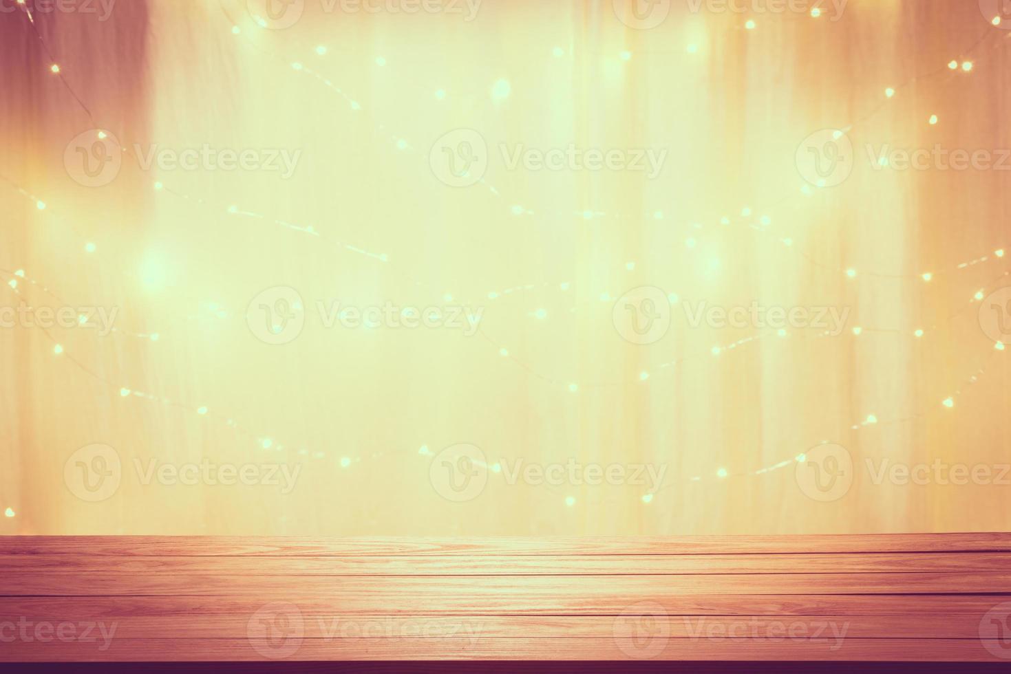 Wood table floor and beautiful lighting effect blurred bokeh background for celebration anniversary Christmas and New Year or birthday, wedding photo