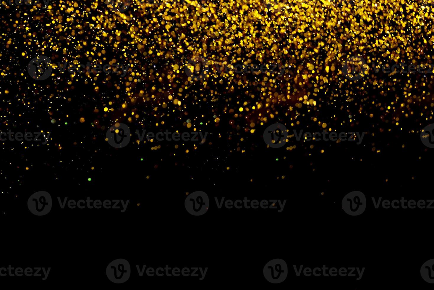 Golden glitter bokeh lighting texture Blurred abstract background for birthday, anniversary, wedding, new year eve or Christmas photo