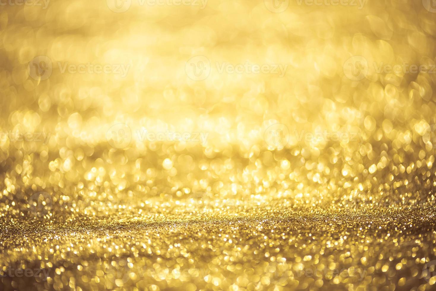 Golden glitter bokeh lighting texture Blurred abstract background for birthday, anniversary, wedding, new year eve or Christmas photo