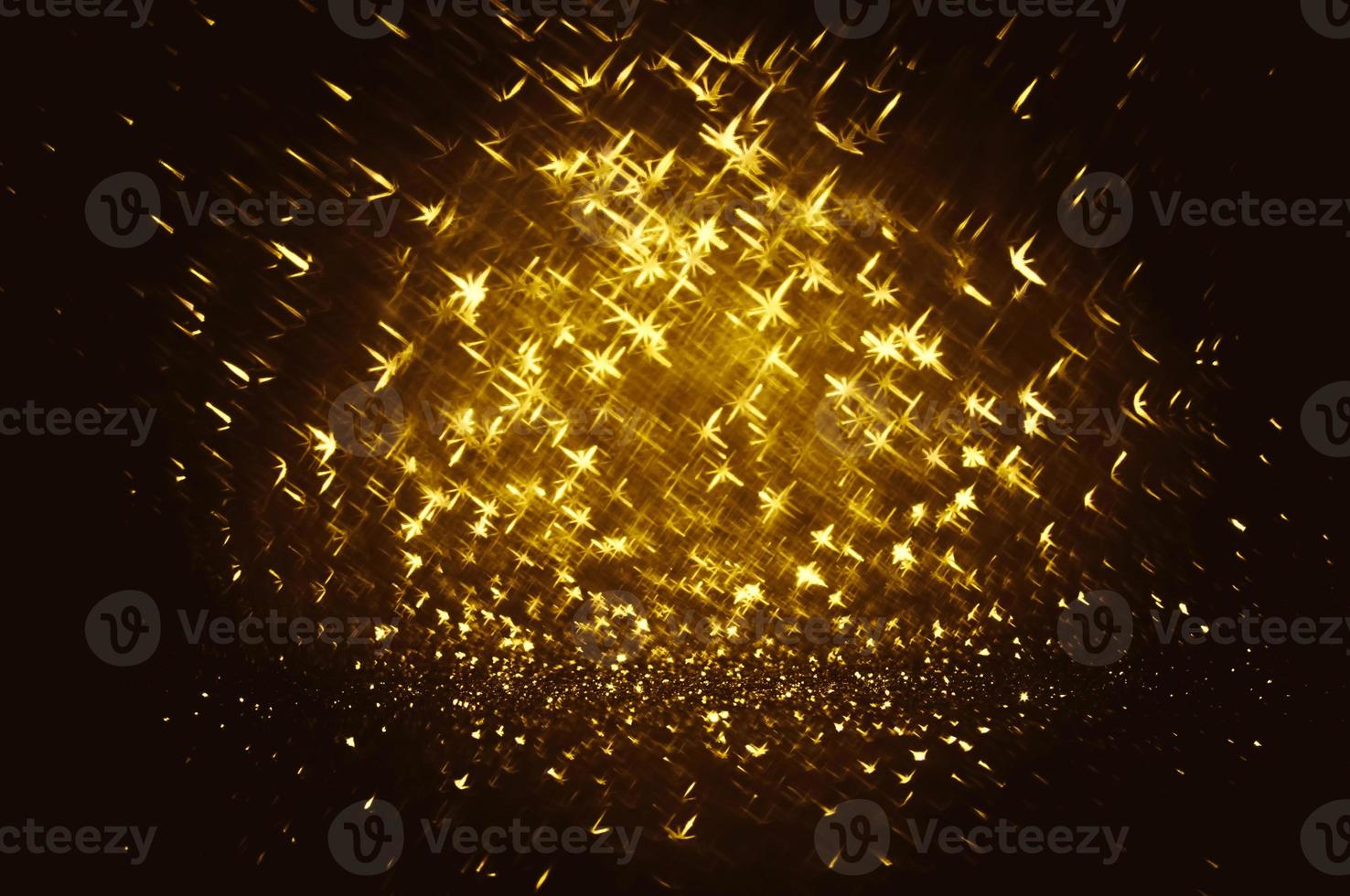 Golden glitter bokeh lighting texture Blurred abstract background for birthday, anniversary, wedding, new year eve or Christmas photo