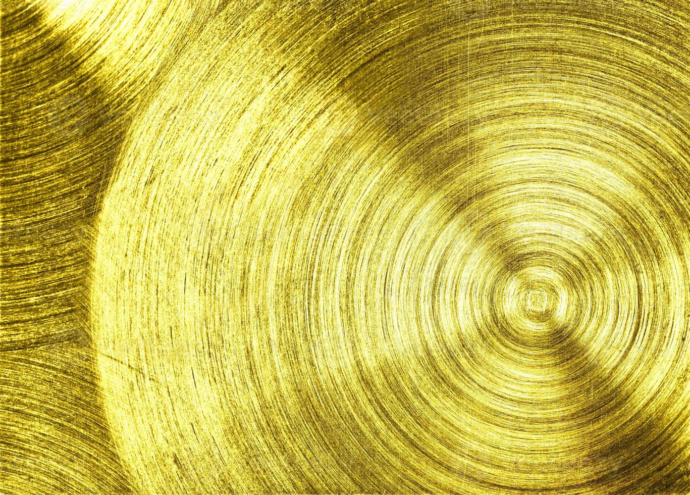 un hierro de metal dorado con fondo de textura circular foto