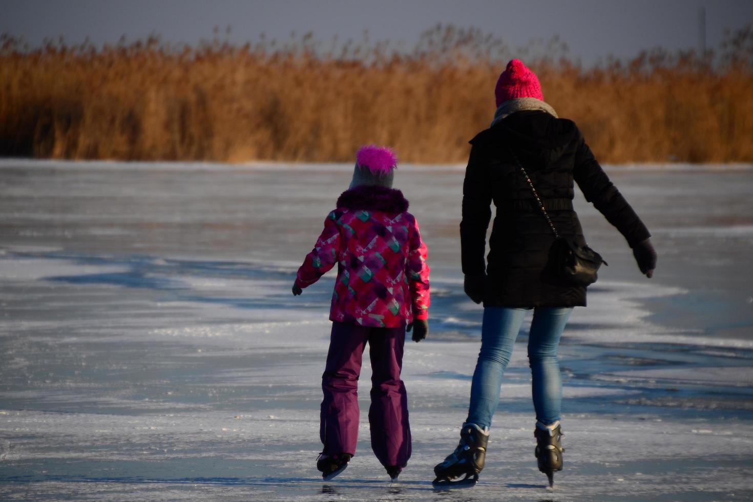 Mother and daughter ice skating photo