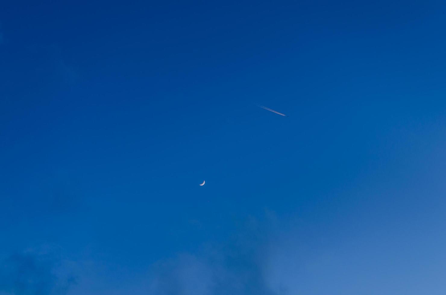 airplane with moon and sky photo