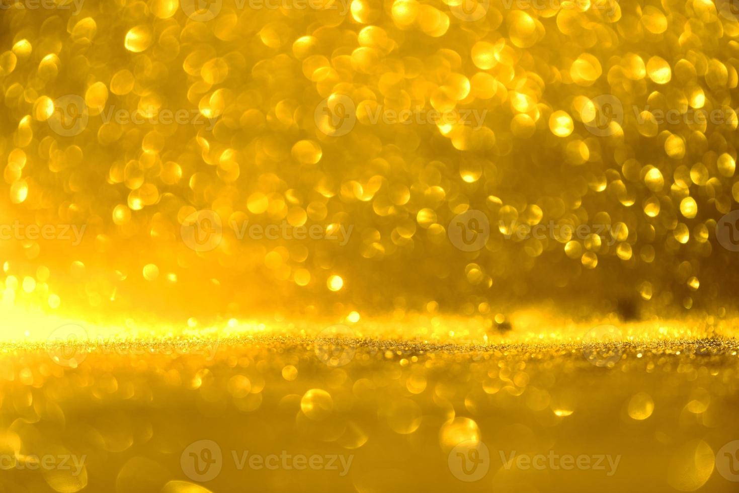 Golden glitter bokeh lighting texture Blurred abstract background for birthday, anniversary, wedding, new year eve or Christmas photo