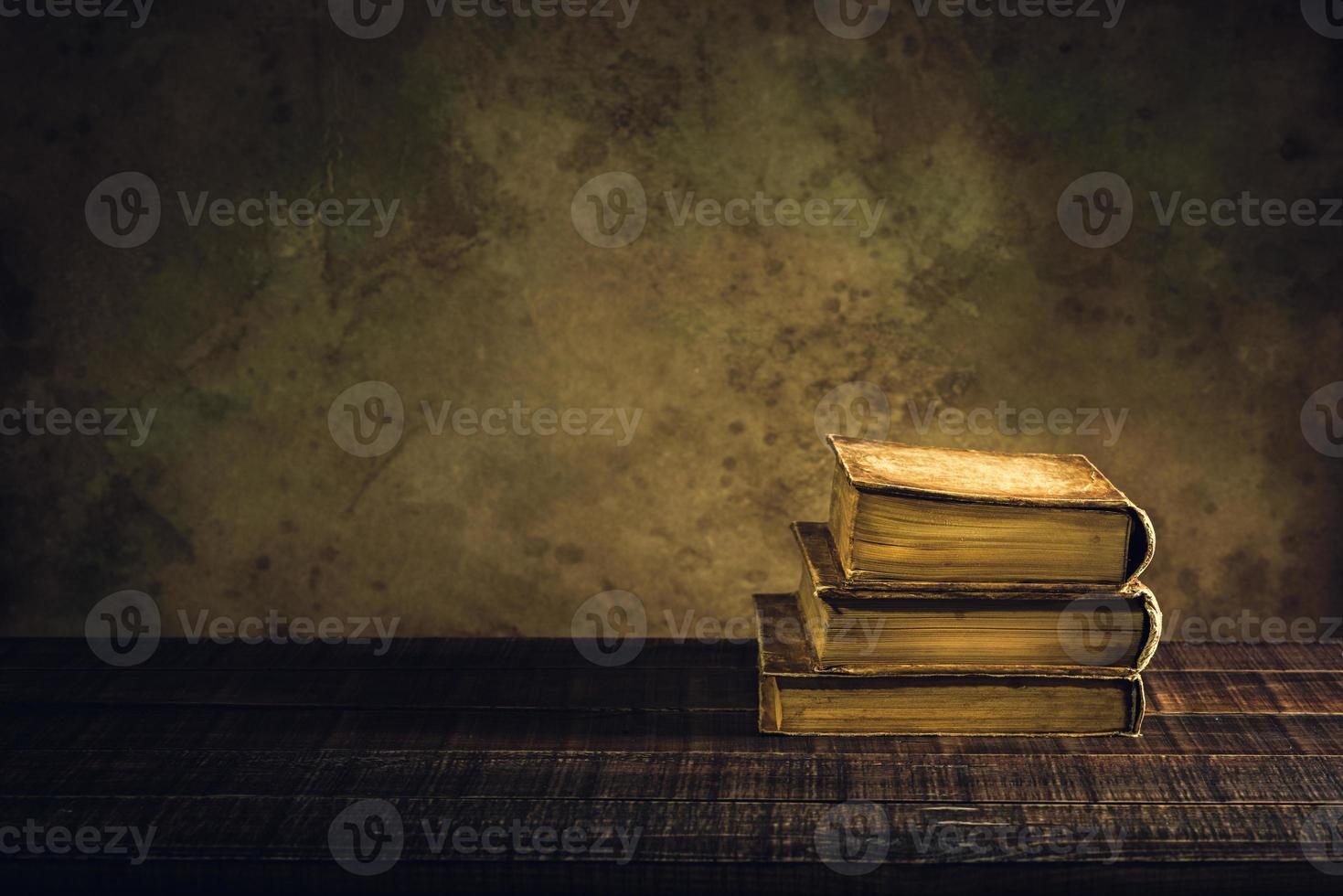 old books vintage on wood floor and paper aged background or texture photo