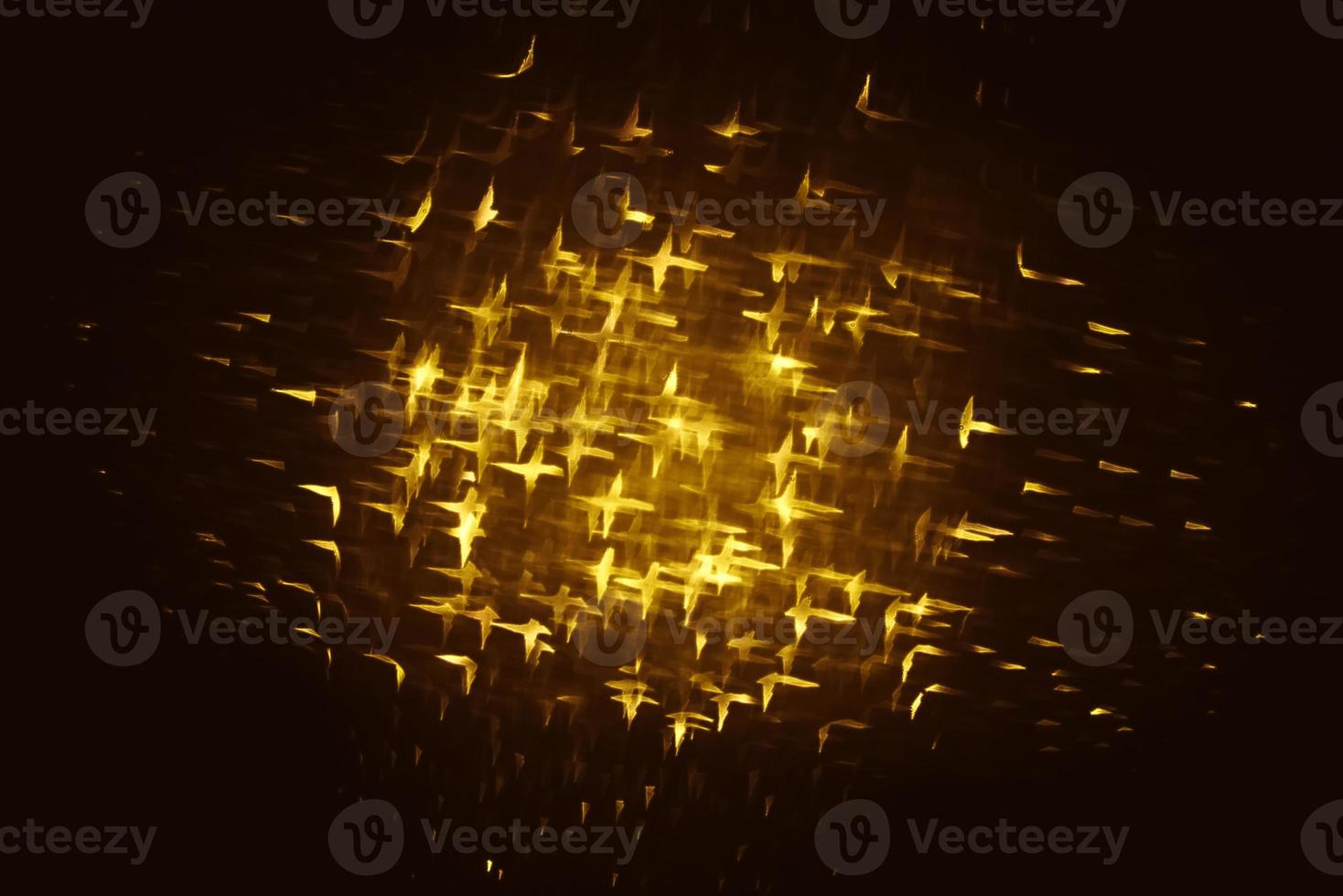 Golden glitter bokeh lighting texture Blurred abstract background for birthday, anniversary, wedding, new year eve or Christmas photo