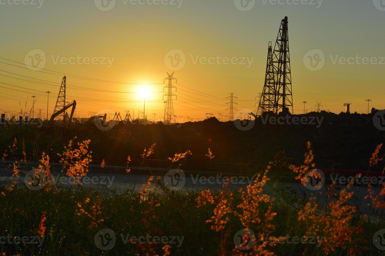 construction site and electrical Pole with Sunrise sky photo