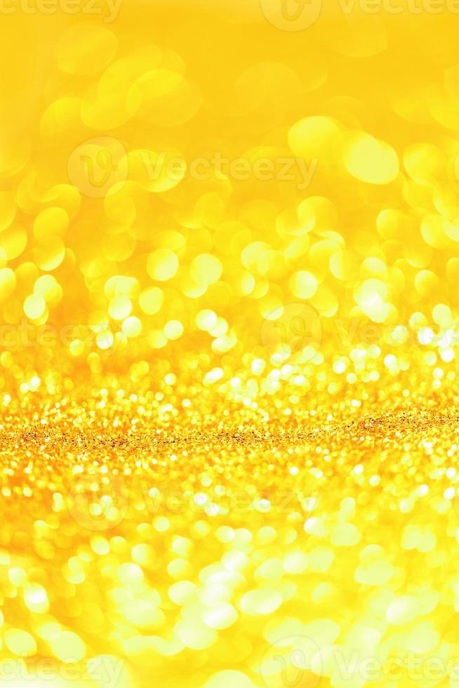 Golden glitter bokeh lighting texture Blurred abstract background for birthday, anniversary, wedding, new year eve or Christmas photo