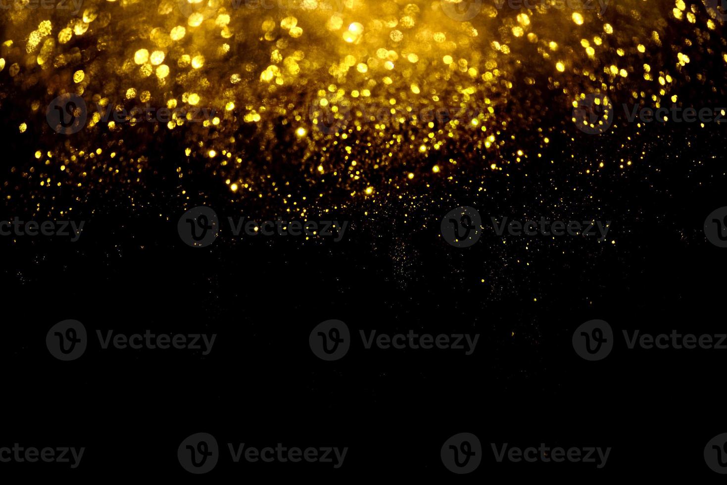 Golden glitter bokeh lighting texture Blurred abstract background for birthday, anniversary, wedding, new year eve or Christmas photo
