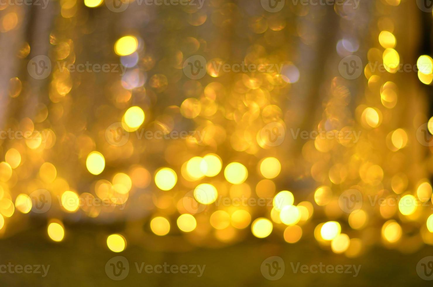 Golden glitter bokeh lighting texture Blurred abstract background for birthday, anniversary, wedding, new year eve or Christmas photo